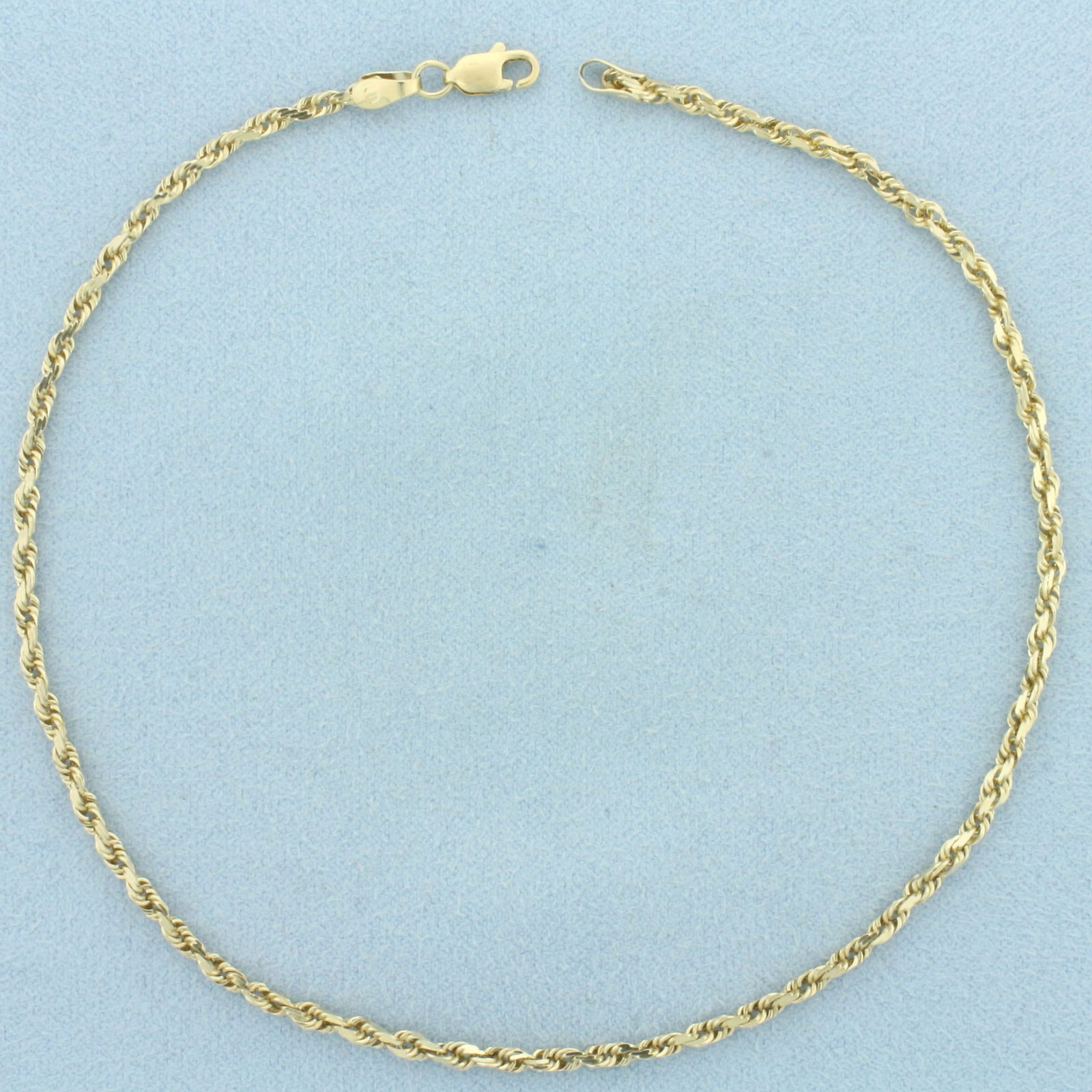 Rope Link Anklet in 10k Yellow Gold: In 10k Yellow Gold. 10 3/4 inches long. 2mm wide. Lobster clasp. 3.9g.