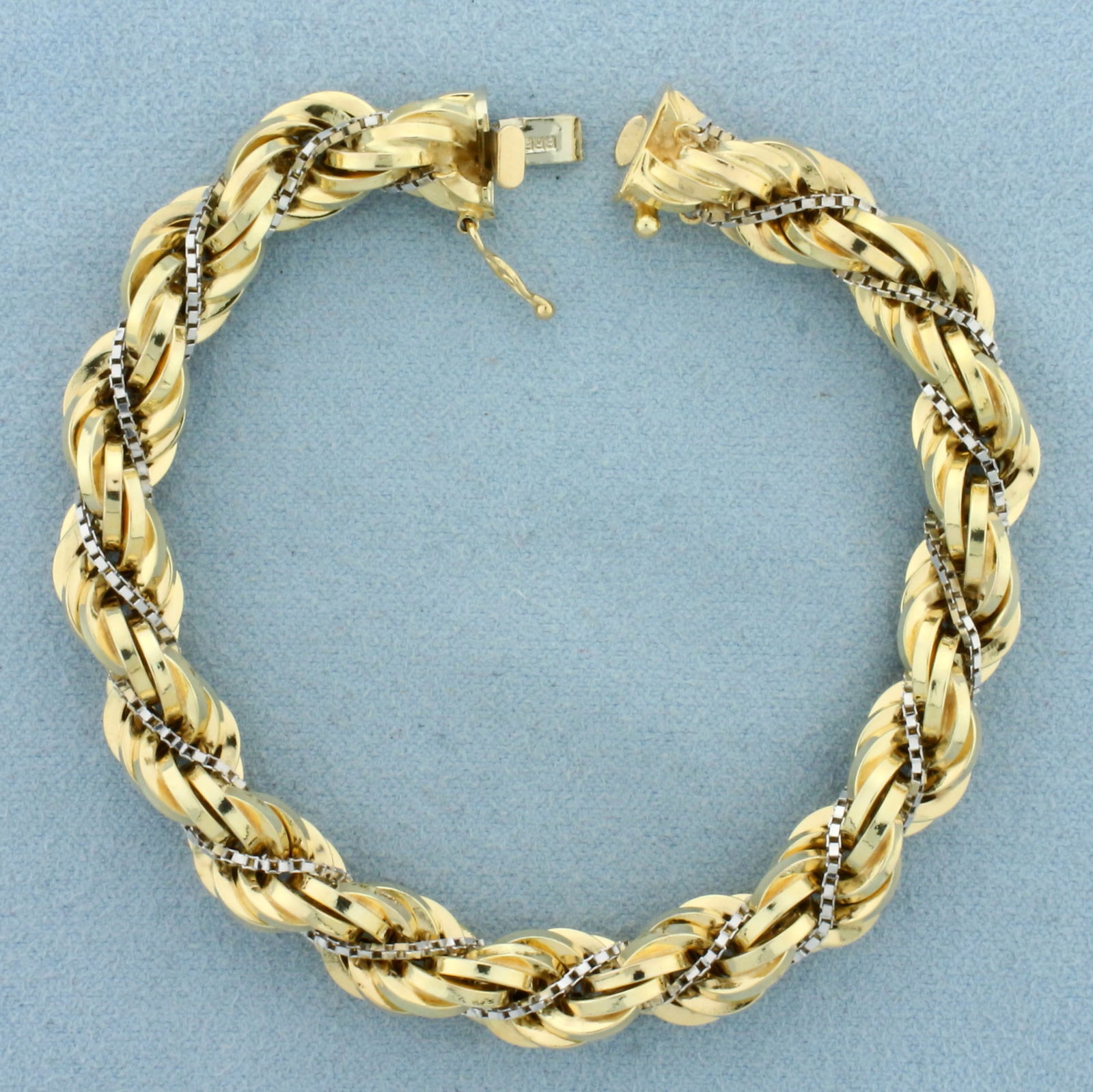 Italian Thick Rope and Box Link Bracelet in 14k Yellow and White Gold: In 14k Yellow and White Gold. 7 1/4 inches long. 8.4mm wide. Italian made. Concealed slide clasp with safety latch. 18.0g.