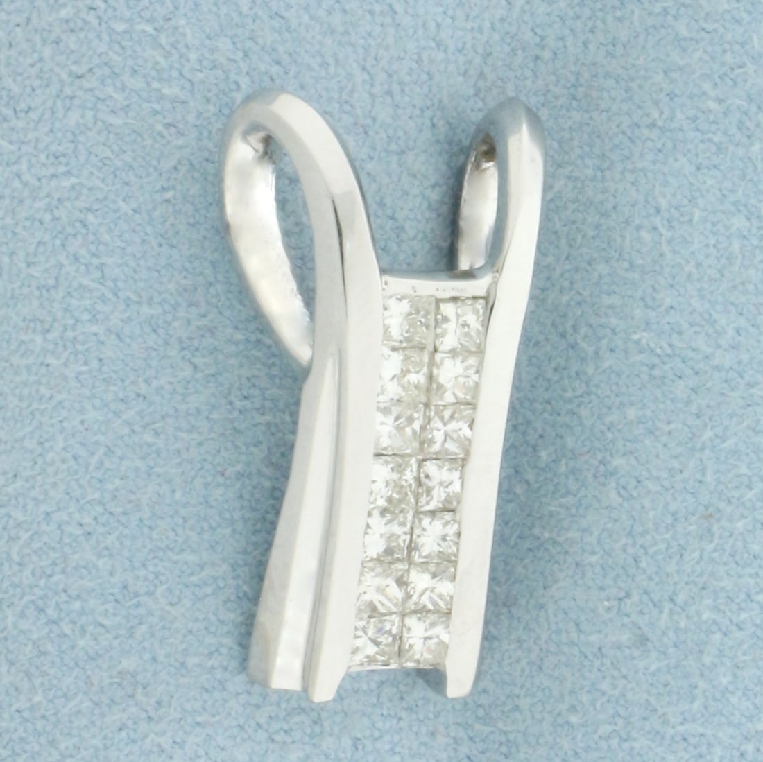 Invisible Set Diamond Pendant or Slide in 18k White Gold: In 18k White Gold. Contains fourteen high quality invisibly set princess cut diamonds, 1.5ct TW, VS clarity/H color. 1 inch long. 1/2 inch wide. 7.3g.