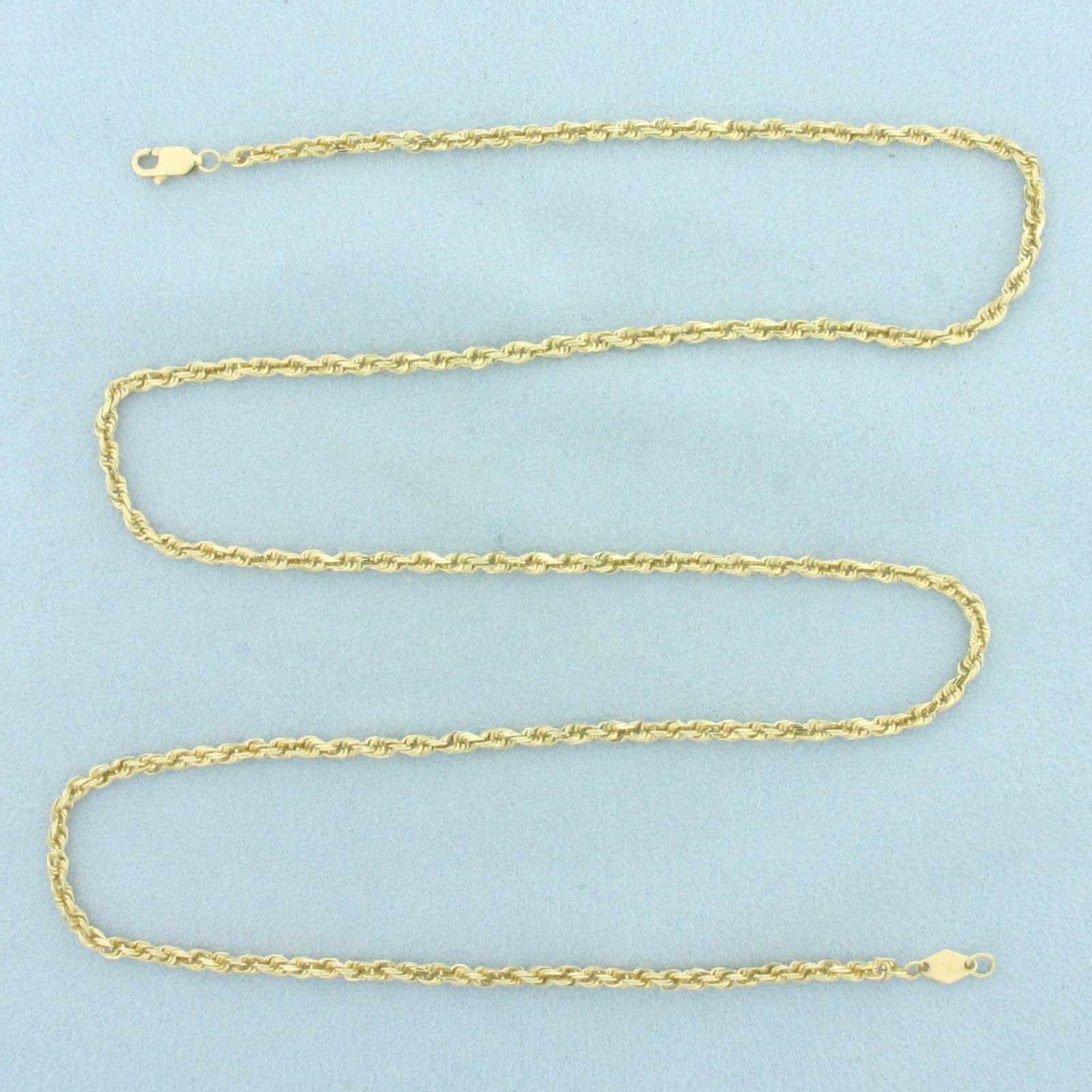 23 Inch Rope Link Chain Necklace in 14k Yellow Gold: In 14k Yellow Gold. 23 inches long. 2.5mm wide. Lobster clasp. 9.2g