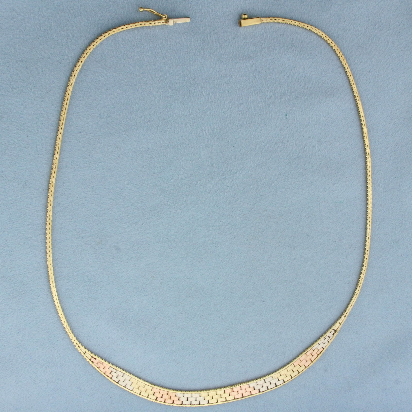 Italian Tri-Color Choker Necklace in 14k Yellow, Rose, and White Gold: In 14k Yellow, Rose, and White Gold. 16 inches long. 6.5mm wide at widest. Italian made. Slide clasp with safety latch. 11.0g.