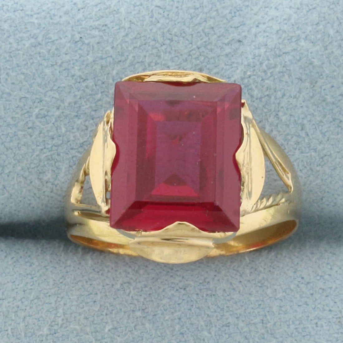 Antique Lab Ruby Solitaire Ring in 18k Yellow Gold: In 18k Yellow Gold. Contains one 12x10mm high quality rectangular Lab created Ruby gemstone, approximately 6cts, with intense color and excellent clarity. Size 7.25.