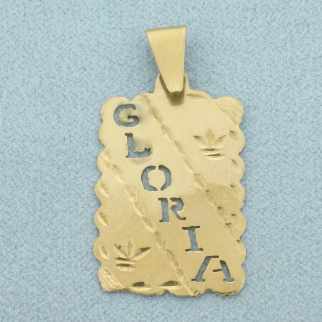 Gloria Cutout Pendant in 14k Yellow Gold: In 14k Yellow Gold. 1 1/4 inch long (including bale). 5/8 inch wide. 1.1g.