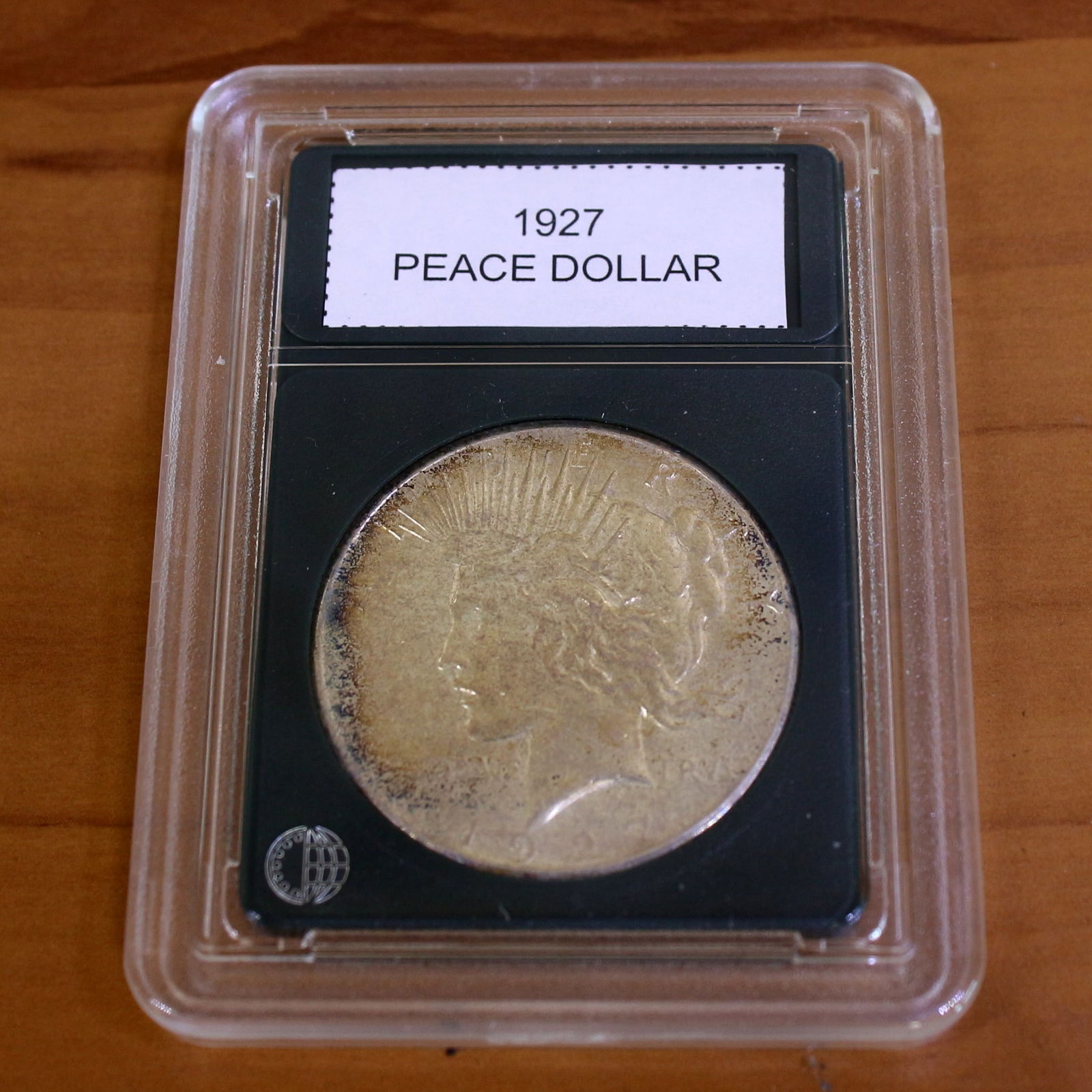 1927 Peace Silver Dollar Coin Key Date in Slab: Condition Shown in picture. From CoinWorld. Key Date.