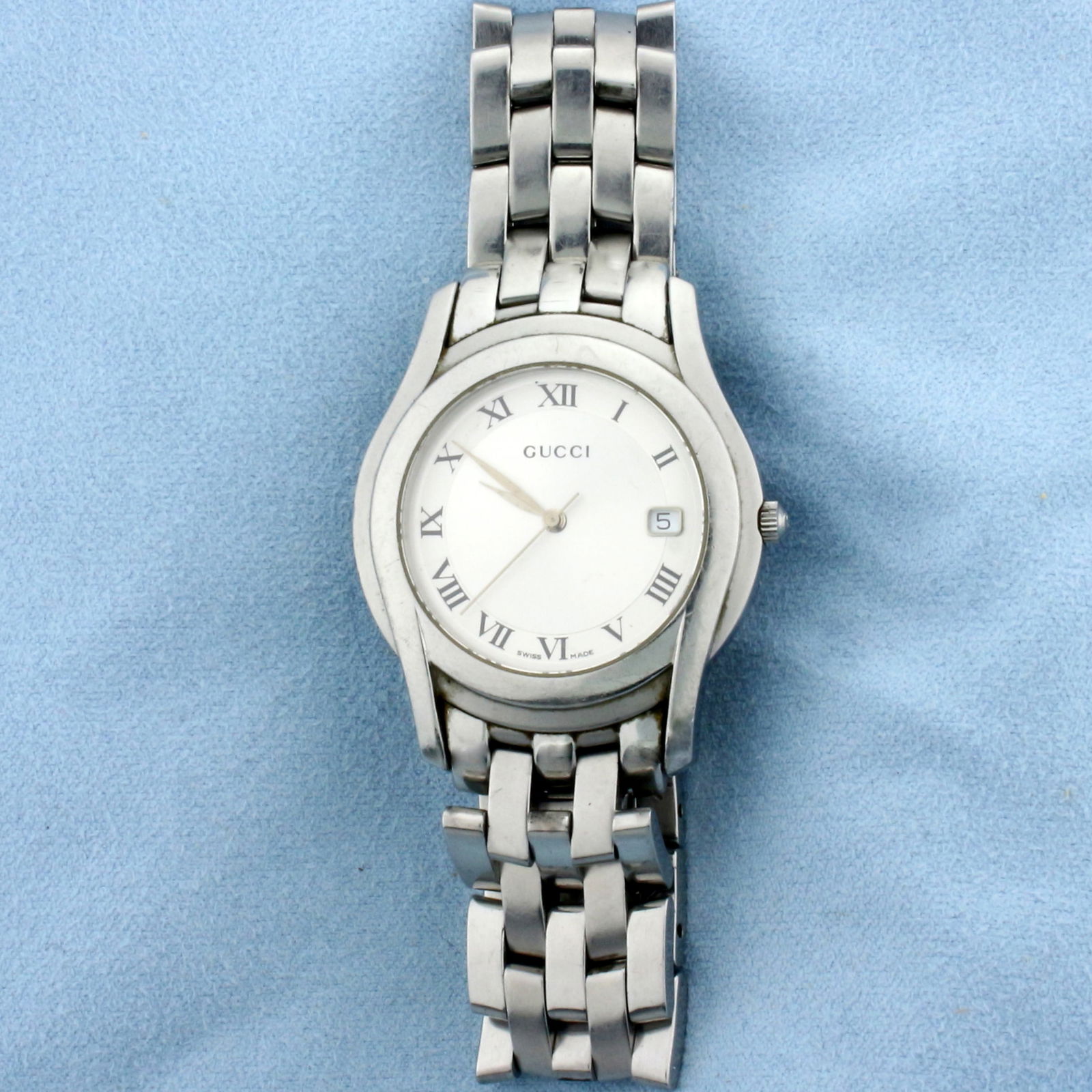 Gucci 5500M Men's Quartz Watch in Stainless Steel: In Stainless Steel. 35mm case. New battery - Swiss movement runs great. Silver dial. Water resistant 5500m. Great overall condition, no scratches on crystal.