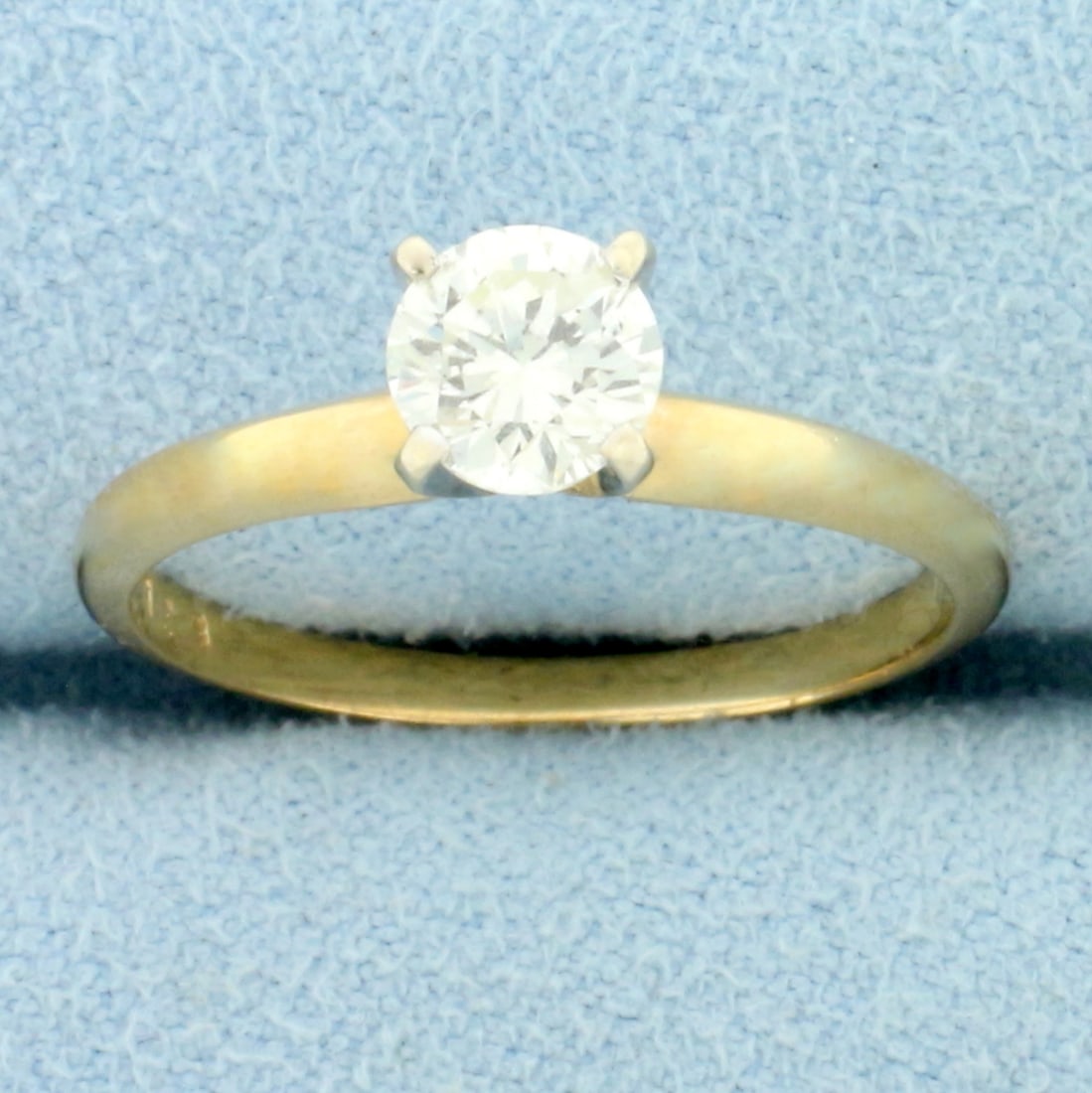 Round Brilliant Diamond Solitaire Engagement Ring in 14K Yellow and White Gold: In 14K Yellow Gold with White Gold Prongs. Contains a high quality 2/3ct round brilliant cut Diamond, SI2 clarity/K color, eye clean and great cut for lots of sparkle. Size 7. 2.3g.