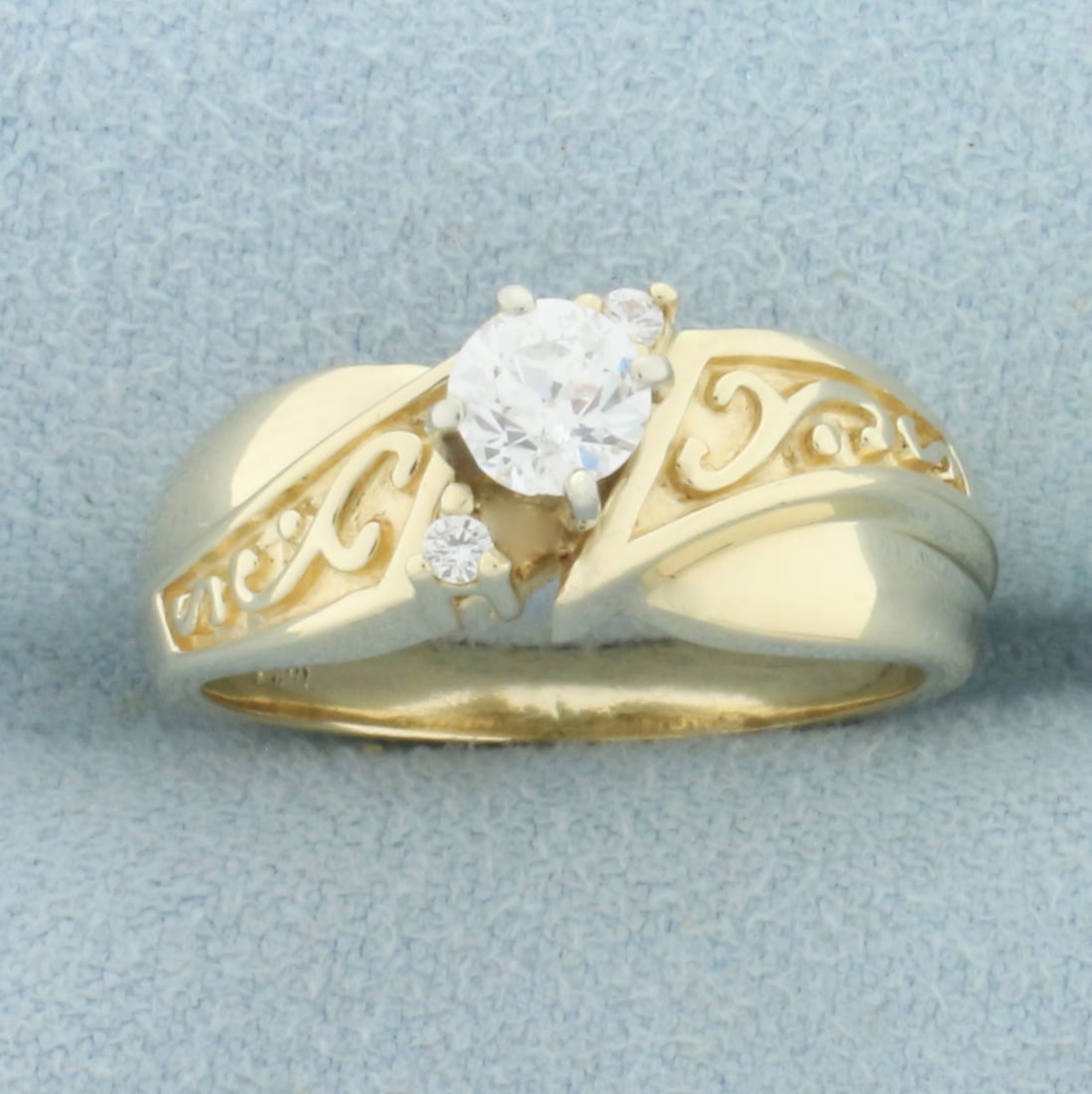Vintage Old European Diamond Engagement Ring in 14k Yellow Gold: In 14k yellow gold. Contains one .4ct Old European Cut diamond VS clarity/H color. Accented with two .01ct diamonds of similar high quality. Size 7. 6.1g.