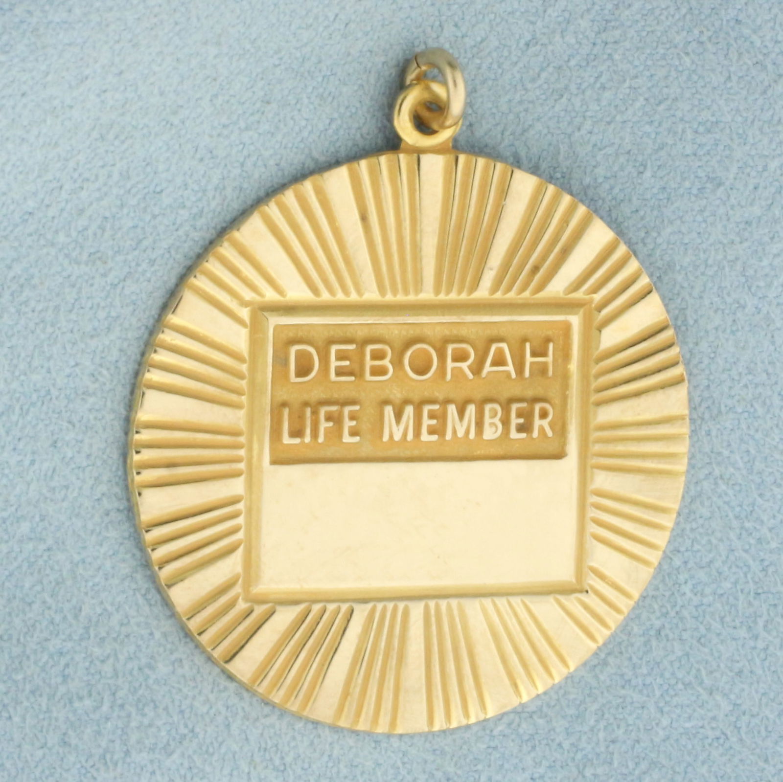 Deborah Life Member Medal Pendant in 10k Yellow Gold: In 10k yellow gold. 1.5 inches long (including jump ring) x 1 1/4 inches wide. "He who serves humanity serves God He who serves Deborah serves both." Volunteer medal from Deborah Heart and Lung Center