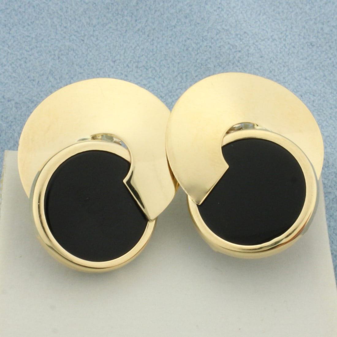Onyx Disc Earrings in 14k Yellow Gold: In 14k yellow gold. Contains two high quality 15mm Onyx gemstones. 1 inch long and 3/4 inches wide. Omega Backs. 7.4g.