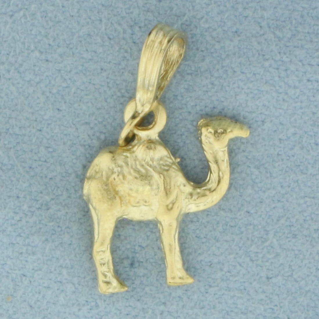 Diamond Cut Camel Pendant in 14k Yellow Gold: In 14k yellow gold. 7/8 inch long and 1/2 inch wide. 1.9g.