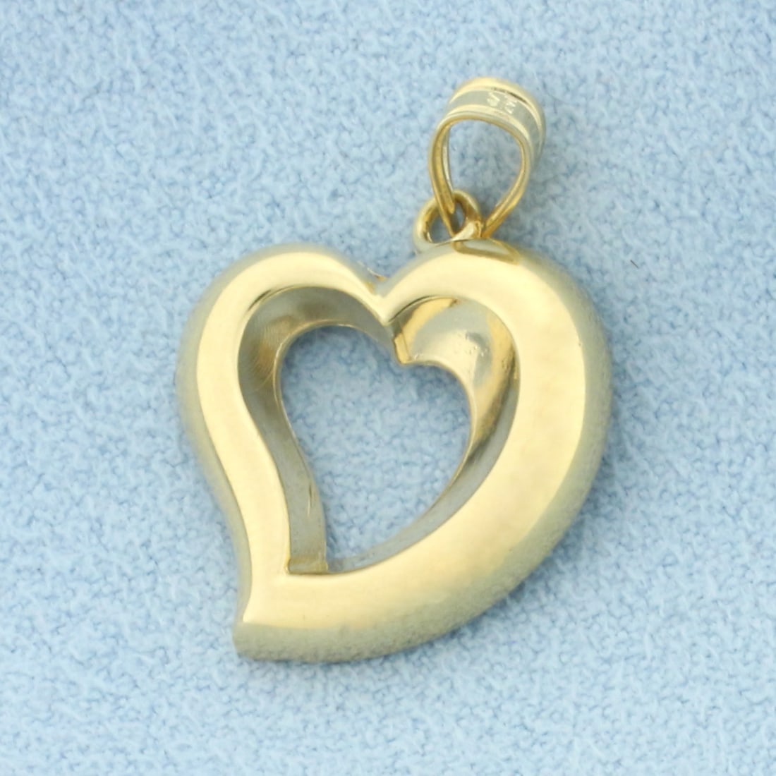 Unique Heart Pendant in 14k Yellow Gold: In 14k Yellow Gold. 1 inch long, 5/8 inch wide. 1.3g.