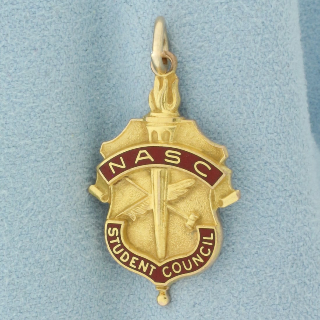 NASC National Association of Student Councils Charm or Pendant in 10k Yellow Gold: In 10k Yellow Gold 1 1/4 inches long, 5/8 inch wide. 3.6g.