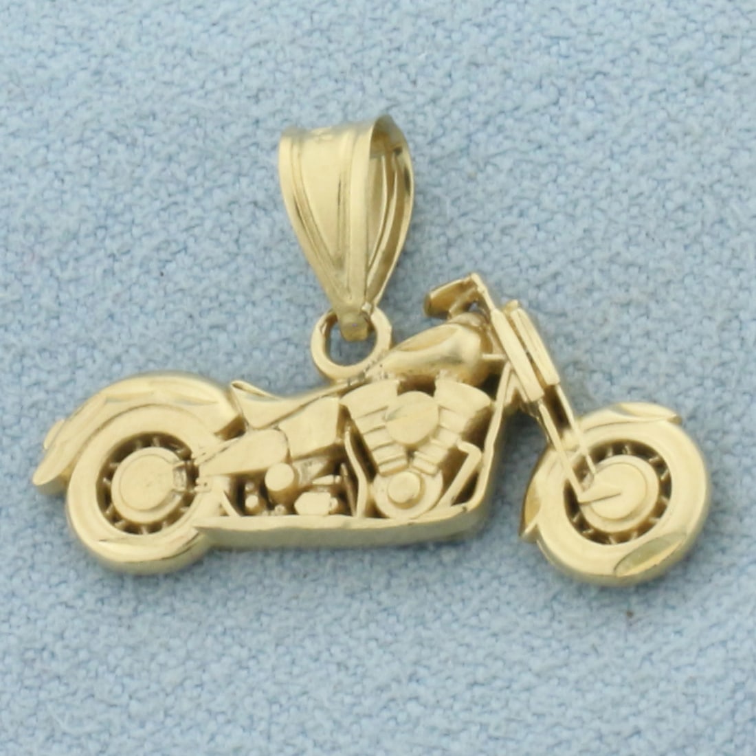 Motorcycle Pendant in 14k Yellow Gold: In 14k Yellow Gold. 5/8 inch long including bale. 1 inch wide. 2.6g.
