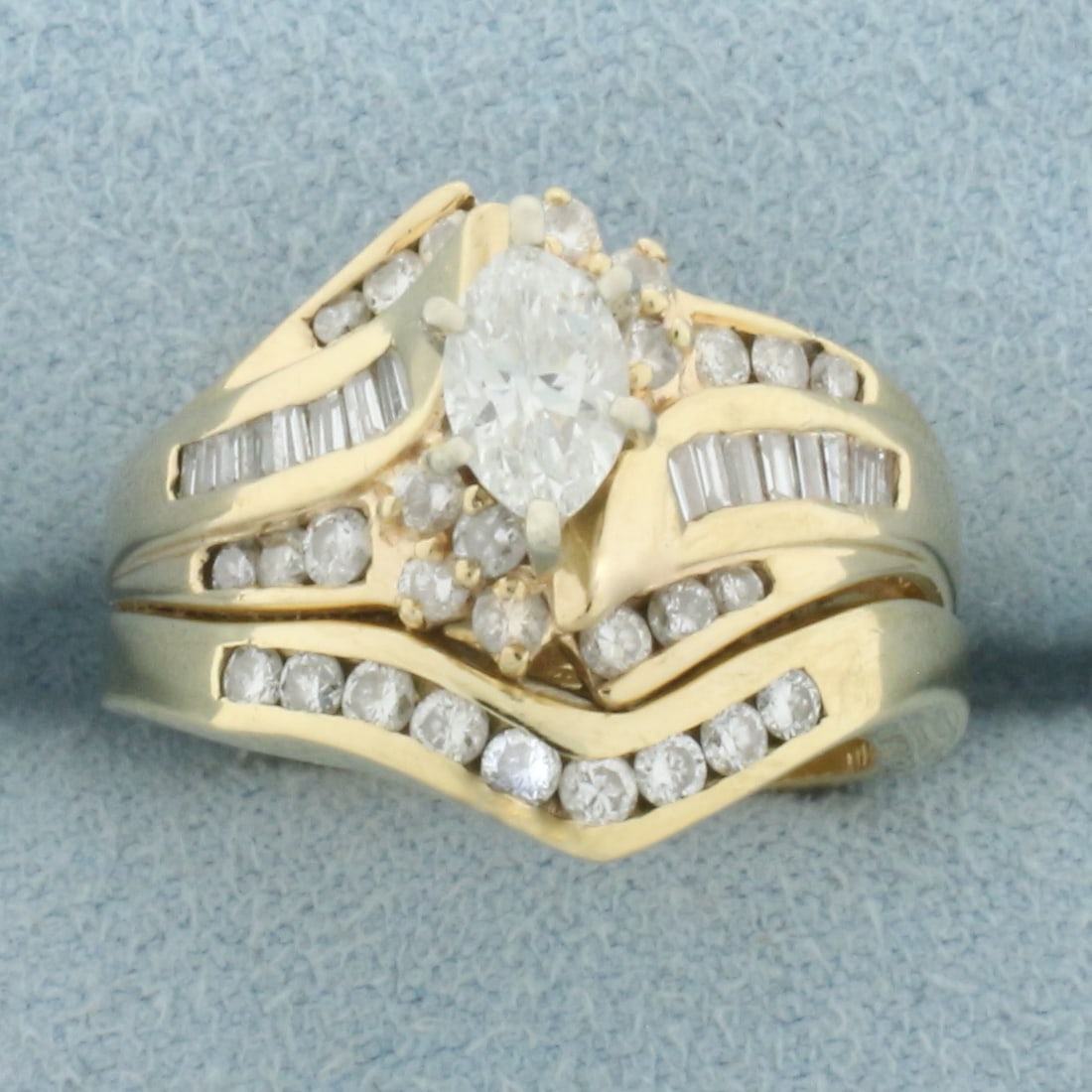 Diamond Wedding Ring and Engagement Ring Bridal Set in 14k Yellow Gold: In 14k Yellow Gold. Contains one .48ct high quality marquise cut diamond, H color/I1 clarity, eye clean, great cut for added brilliance. Also contains sixteen baguette and twenty-nine round diamonds,