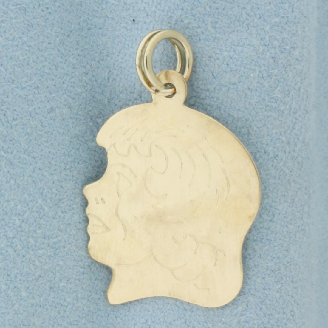 Engravable Girl Silhouette Charm or Pendant in 14k Yellow Gold: In 14k Yellow Gold. 1 1/8 inch long including jump ring. 3/4 inch wide. Split ring for easy attachment. 2.1g.