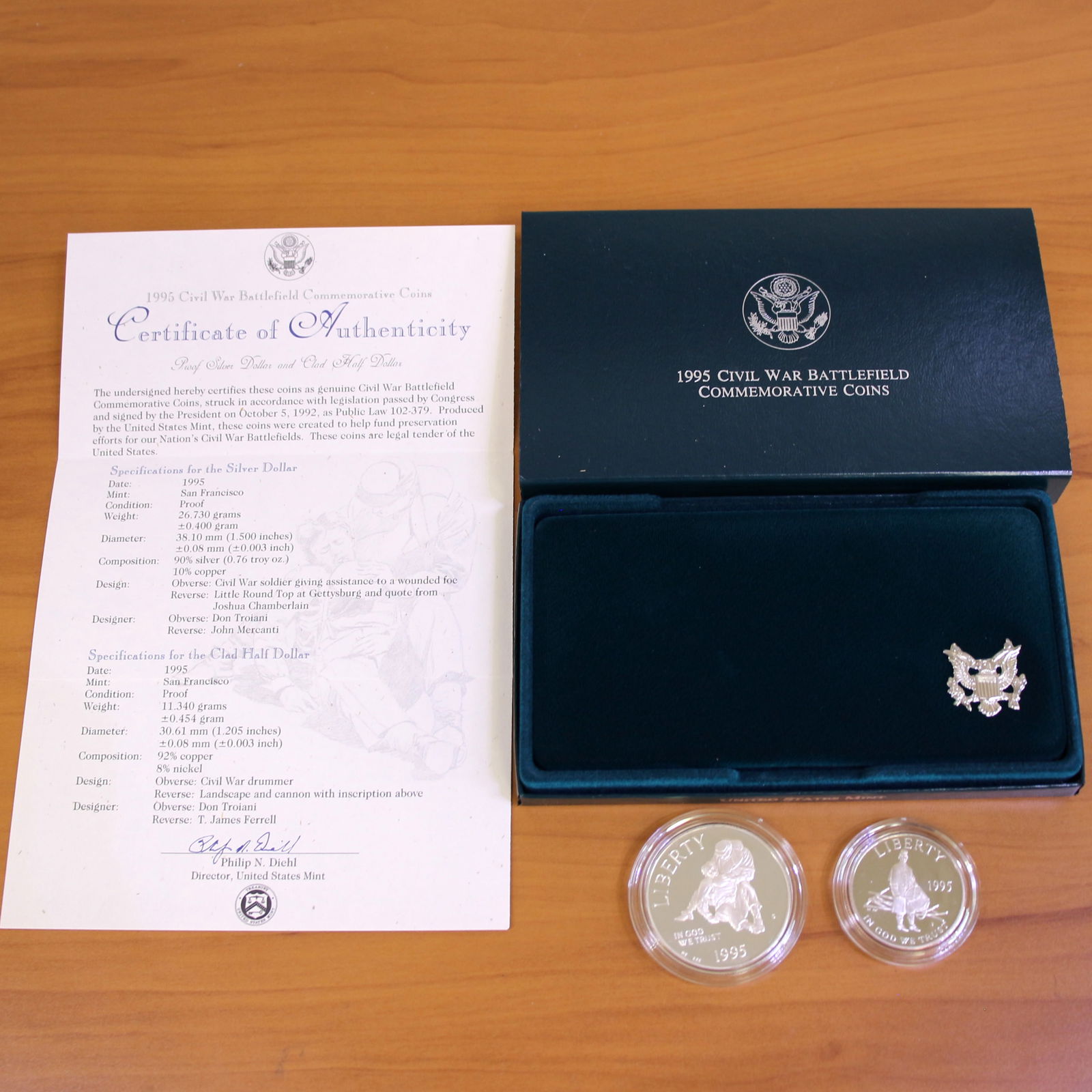 US Mint Civil War Battlefield Silver Proof Coin Set OGP: Contains one 1995 90% Silver Commemorative Silver Dollar. Also contains one 1995 Clad Half Dollar. Set in original packaging and contains certificate of authenticity.