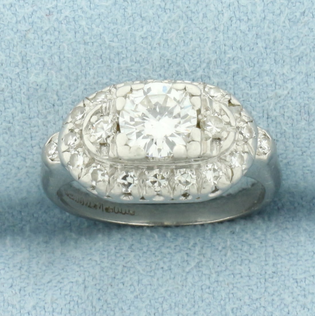 Diamond Engagement Ring in Platinum: In Platinum. Contains one 2/3ct round brilliant diamonds, SI clarity/I color, great cut for lots of sparkle. Also contains 1/3ct TW of diamonds of similar high quality surrounding center diamond. 9mm