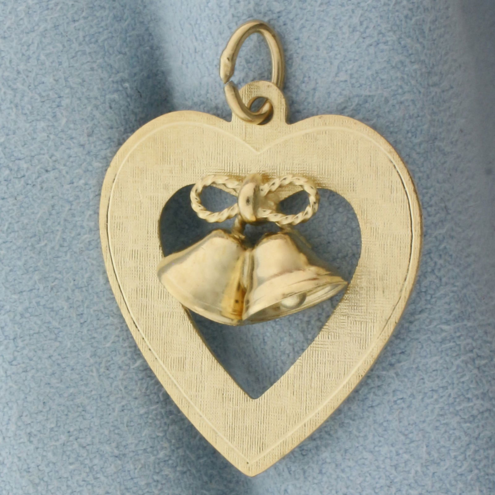 Wedding or Anniversary Bells Heart Pendant or Charm in 14k Yellow Gold: In 14k Yellow Gold. 1 1/4 inch long (including jump ring). 1 inch wide. Bells have clappers that make noise when shaken. Can engrave initials or date on back. 3.6g.
