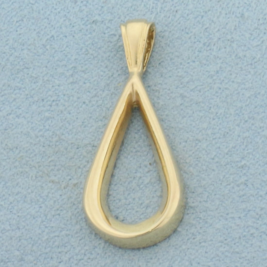 High Polish Teardrop Pendant in 14k Yellow Gold: In 14k Yellow Gold. 1 1 /16 inches long. 1/4 inch wide. 2.2g.