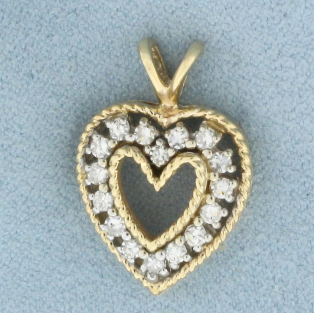 Diamond Heart Pendant in 14k Yellow Gold: In 14k Yellow Gold. Contains sixteen high quality diamonds, 3/4ct TW, H color/I clarity. 7/8 inch long including bale. 5/8 inch wide. 4.4g.