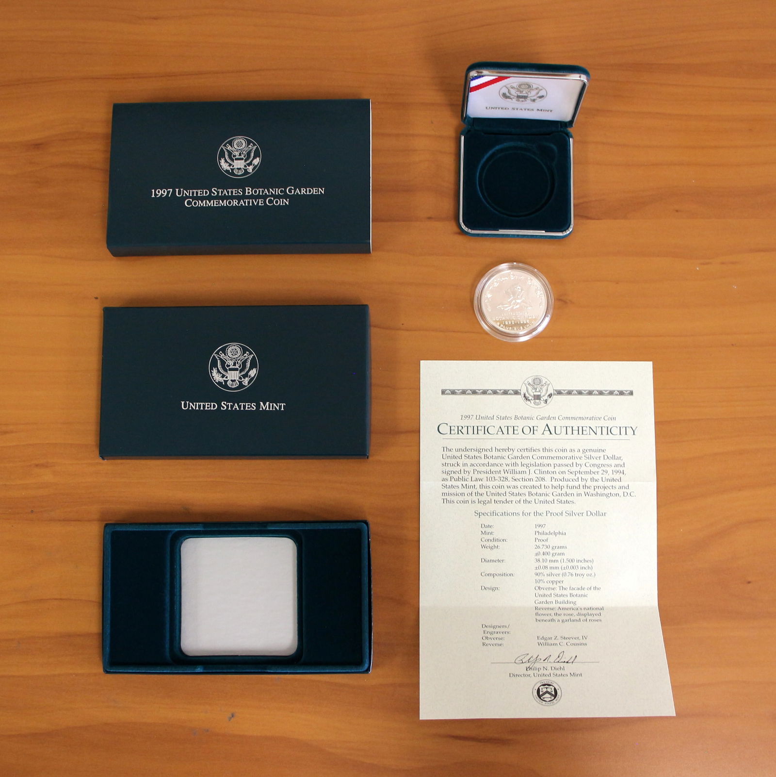 US Mint 1997 Silver Botanic Garden Silver Dollar Proof Coin OGP: Contains one 1997 90% Silver U.S. Mint Botanic Garden Commemorative Silver Dollar. Includes original packaging, casing, and CoA.