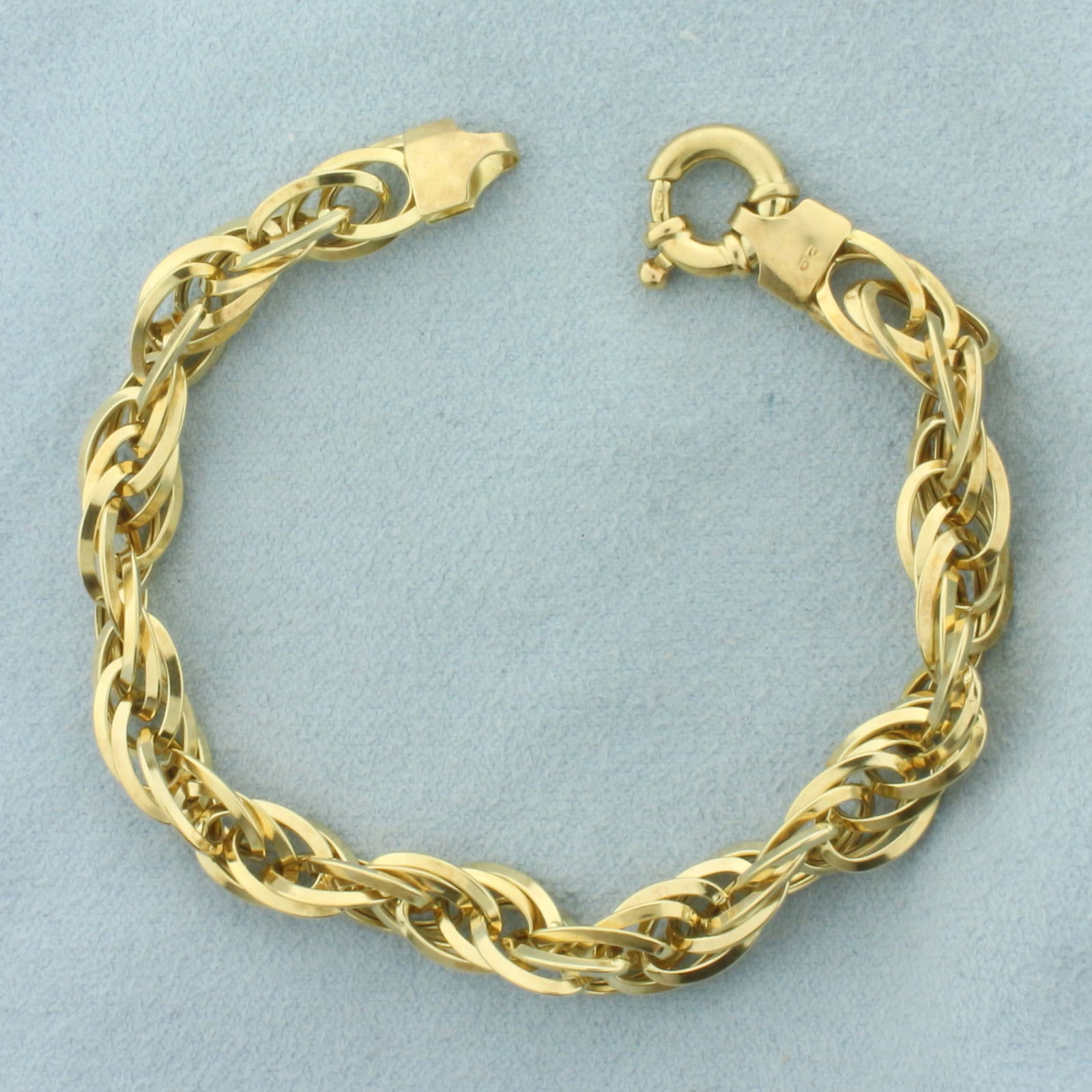 Italian Large Link Rope Bracelet in 18k Yellow Gold: In 18k Yellow Gold. 7 1/4 inches long. 1/4 inch wide. Italian made. Decorative spring clasp. 8.8g.