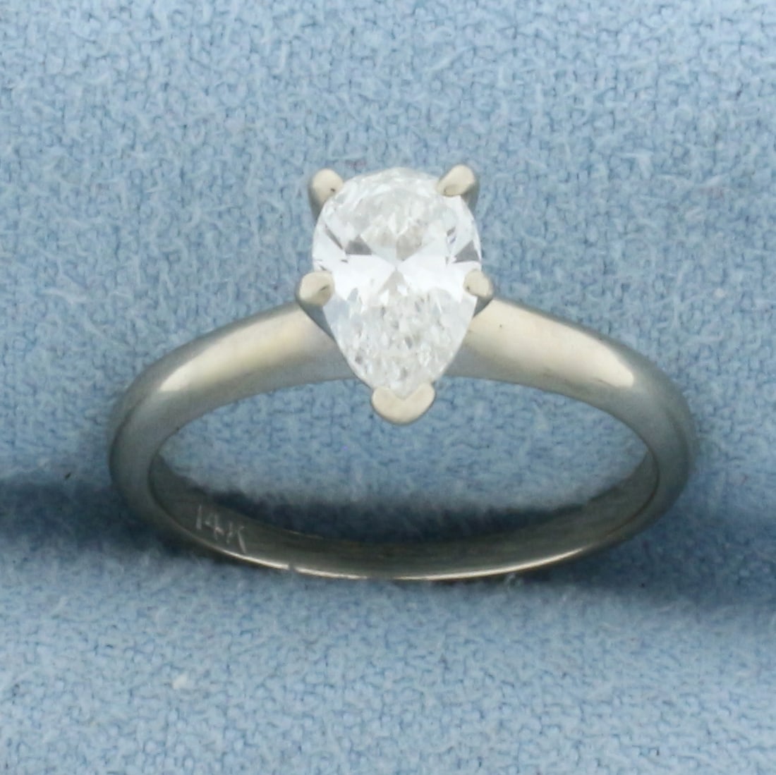 1ct Pear Diamond Solitaire Engagement Ring in 14K White Gold: In 14K White Gold. Contains one high quality 1ct pear shaped diamond, VS clarity/I color, great cut for lots of sparkle. Size 4. 2.1g.
