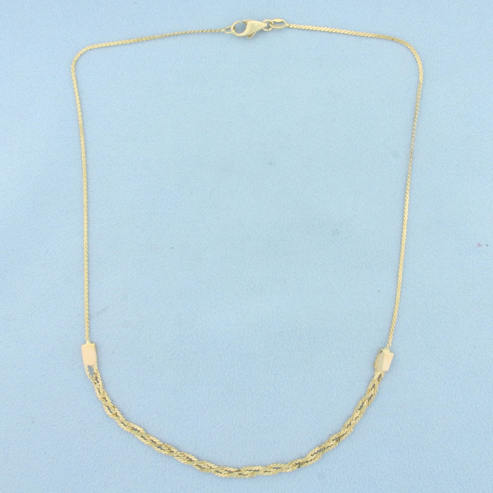 16 Inch Italian Braided Serpentine Link Necklace in 18k Yellow Gold: In 18k yellow gold. Italian made. 16 inches long and 4mm wide at widest. Spring clasp. 5.7g.