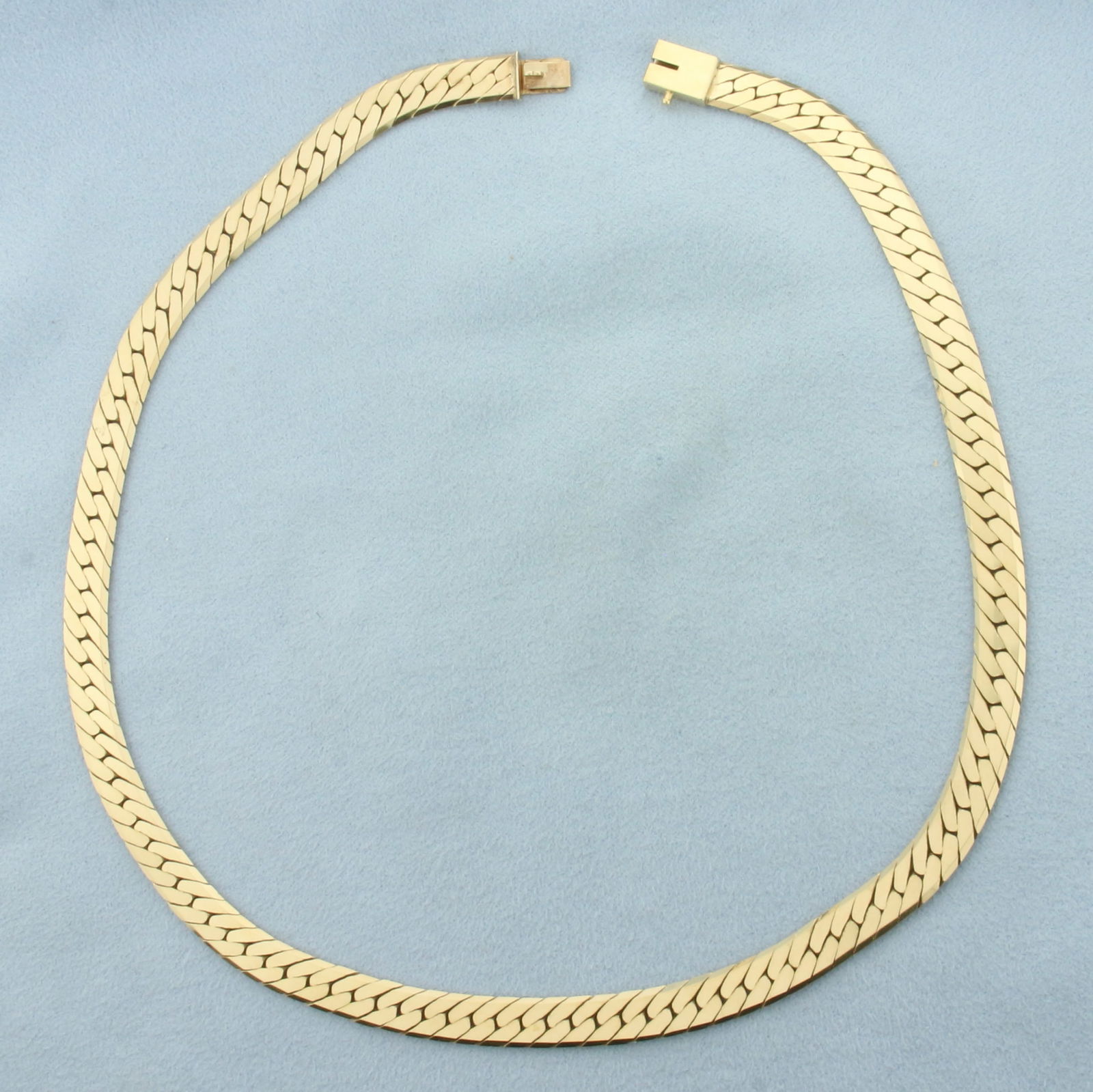 16 Inch Herringbone Link Choker Necklace in 14k Yellow Gold: In 14k Yellow Gold. 16 inches long. 6.75mm wide. Slide clasp. 33.8g.