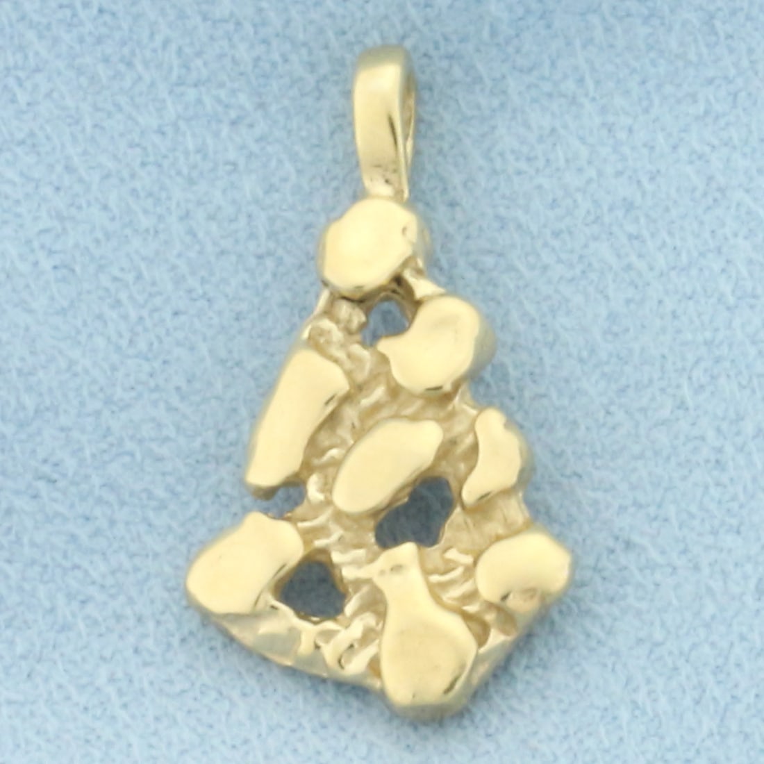 Freeform Gold Nugget Pendant in 14k Yellow Gold: In 14k Yellow Gold. 1 inch long (including bale). 1/2 inch wide. 3.4g.