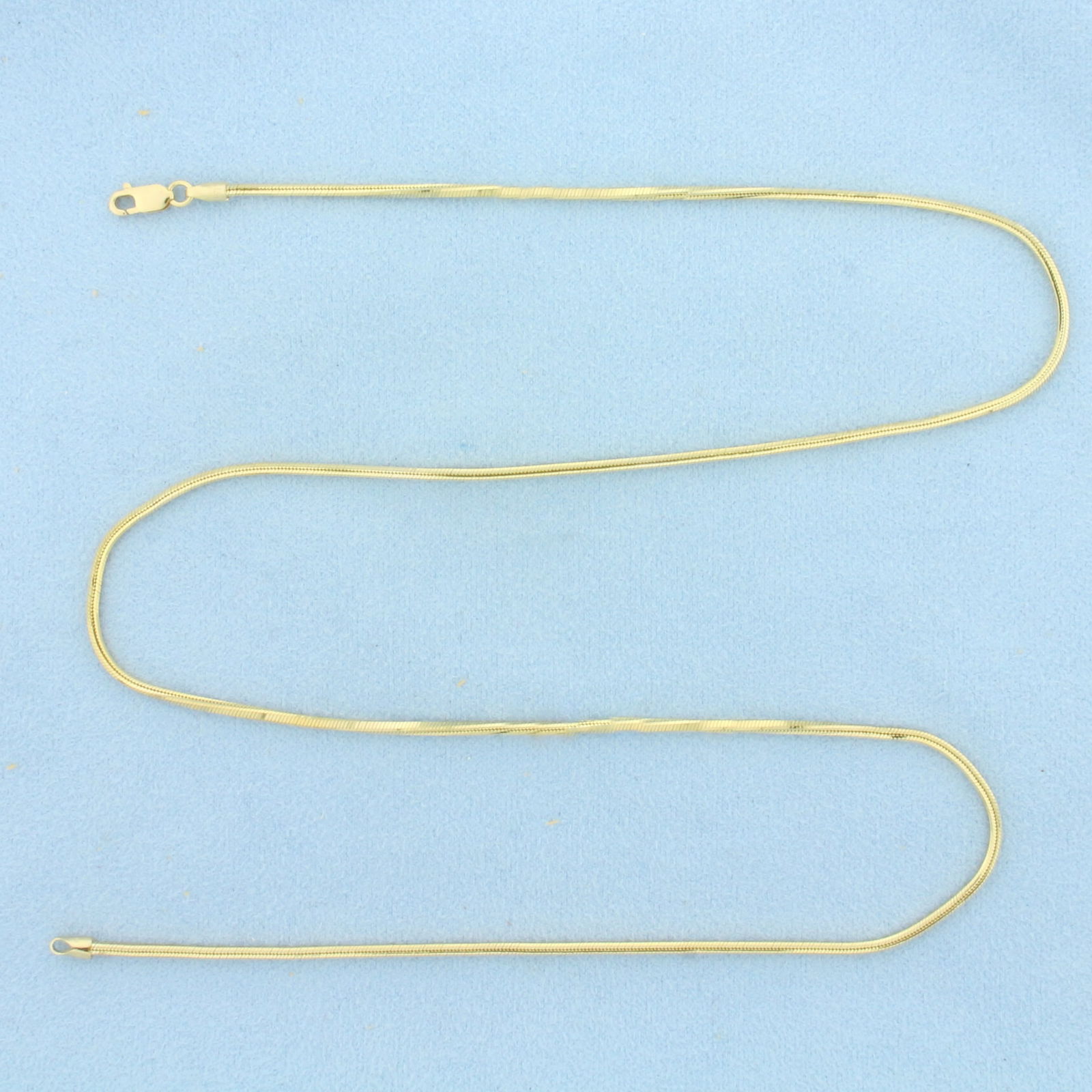 20 Inch Italian Snake Link Chain Necklace in 14k Yellow Gold: In 14k Yellow Gold. 20 inches long. 1.7mm wide. Italian made. Lobster clasp. 9.0g