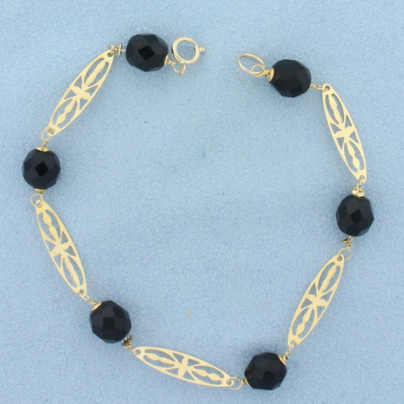 Vintage Onyx Bracelet in 14K Yellow Gold: In 14k yellow gold. Measures 8 inches long. Contains 6 faceted high quality Onyx gemstone beads, 7.2mm each. Spring clasp. 5.2g.