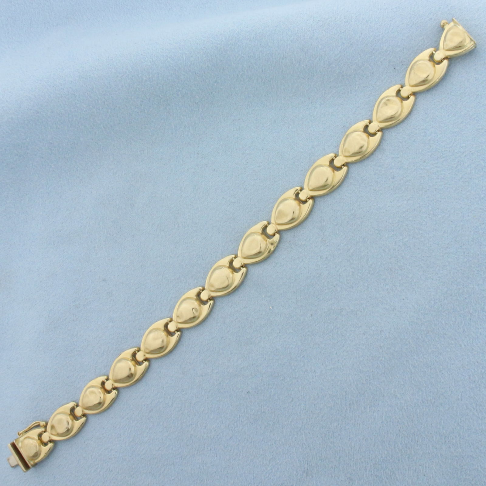 Vintage Puffy Link Bracelet in 14K Yellow Gold: In 14K Yellow Gold. 7 inches long, 9.7mm wide. Safety clasp. Some links have small dents in them, does not take away from beautiful of bracelet, they blend into design, indicative of age. 10.0g.