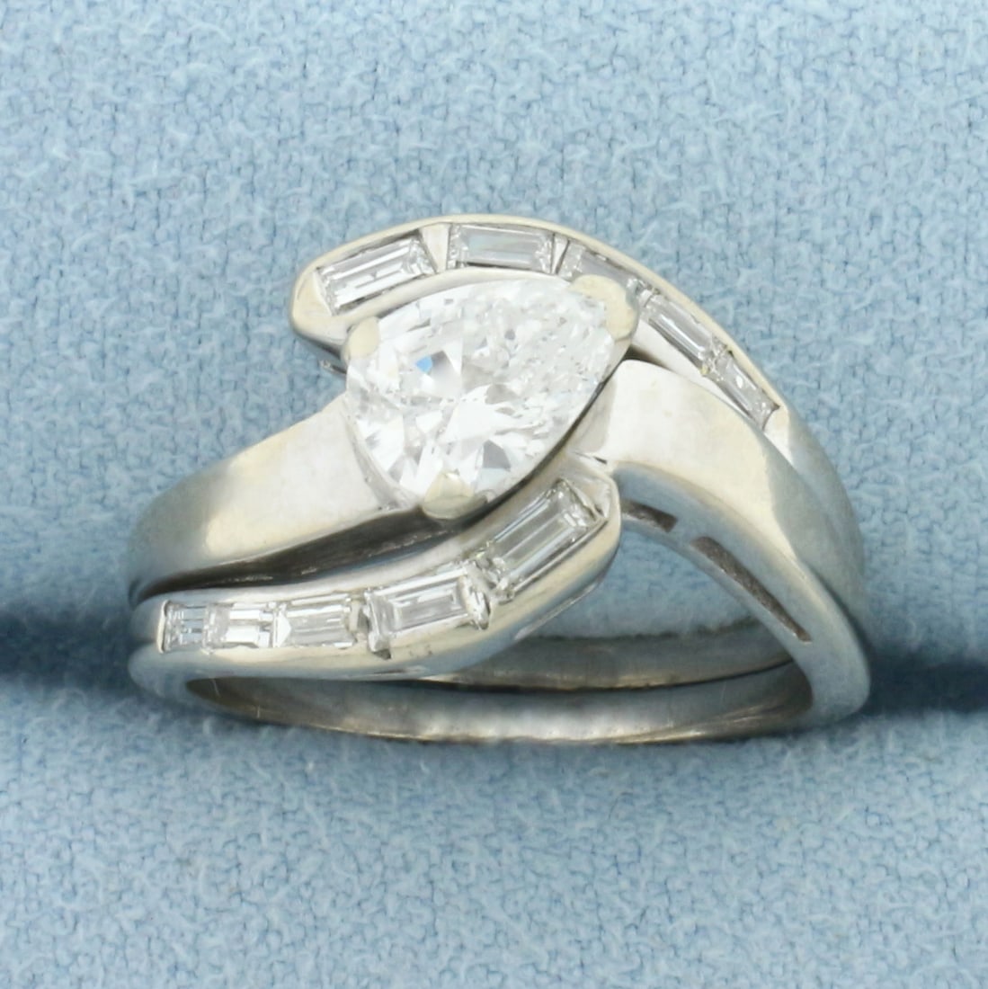 Pear Diamond Wedding and Engagement Ring Bridal Set in 14k White Gold: In 14k White Gold. Contains one high quality 7.5mm, 2/3ct pear shaped diamond, I1 clarity/H color, eye clean. Also contains ten baguette diamonds, 1/3ct TW, of similar high quality. Wedding and Engage