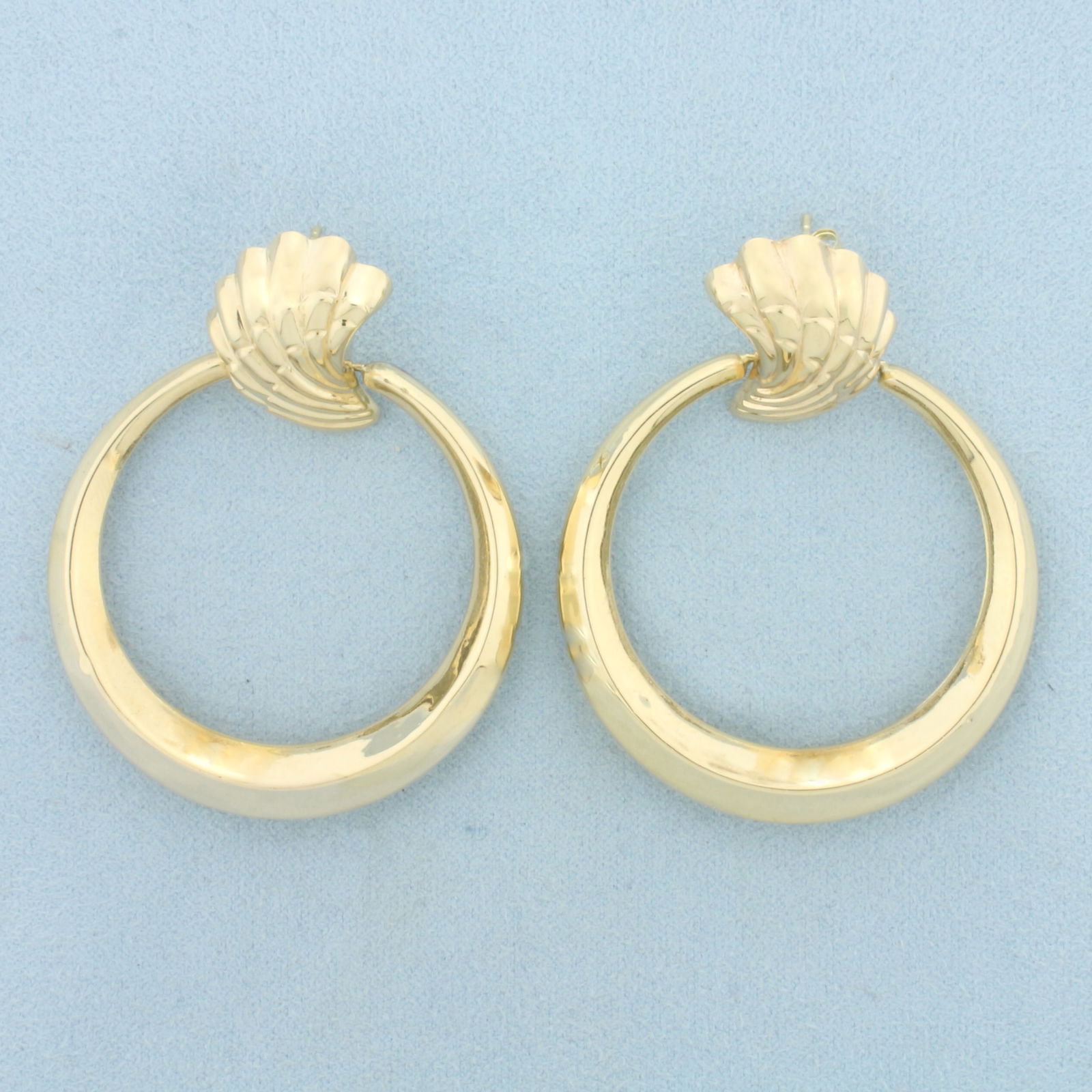 Seashell Hoop Earrings in 14k Yellow Gold: In 14k Yellow Gold. 2 1/4 inches long. 1 3/4 inches wide. Friction backs. 9.6g.