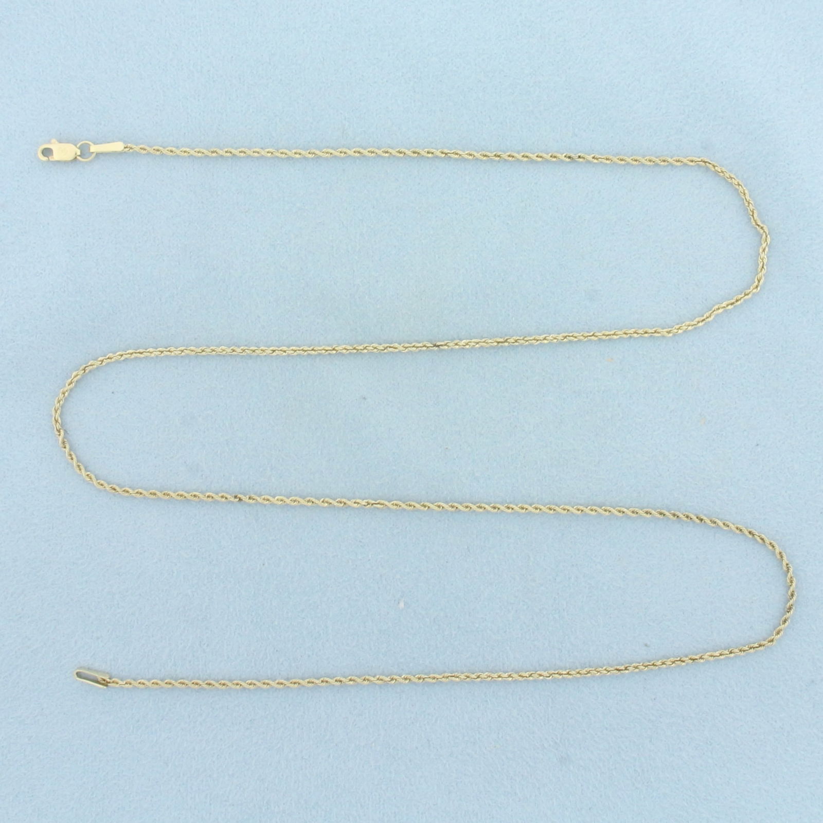 20 Inch Rope Link Chain Necklace in 14k Yellow Gold: In 14k Yellow Gold. 20 inches long. 1.2mm thick. Lobster clasp. 3.2g.