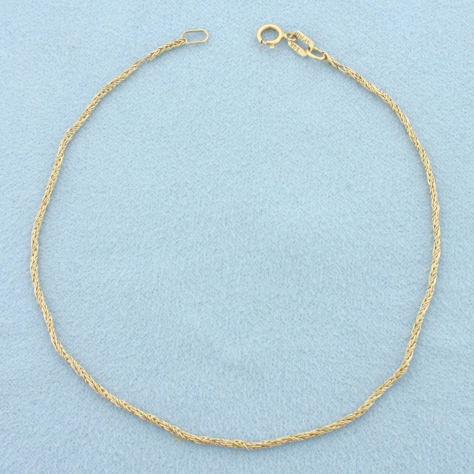 Wheat Link Bracelet in 14k Yellow Gold: In 14k Yellow Gold. 8 inches long. 1.1mm wide. Spring clasp. 1.3g.