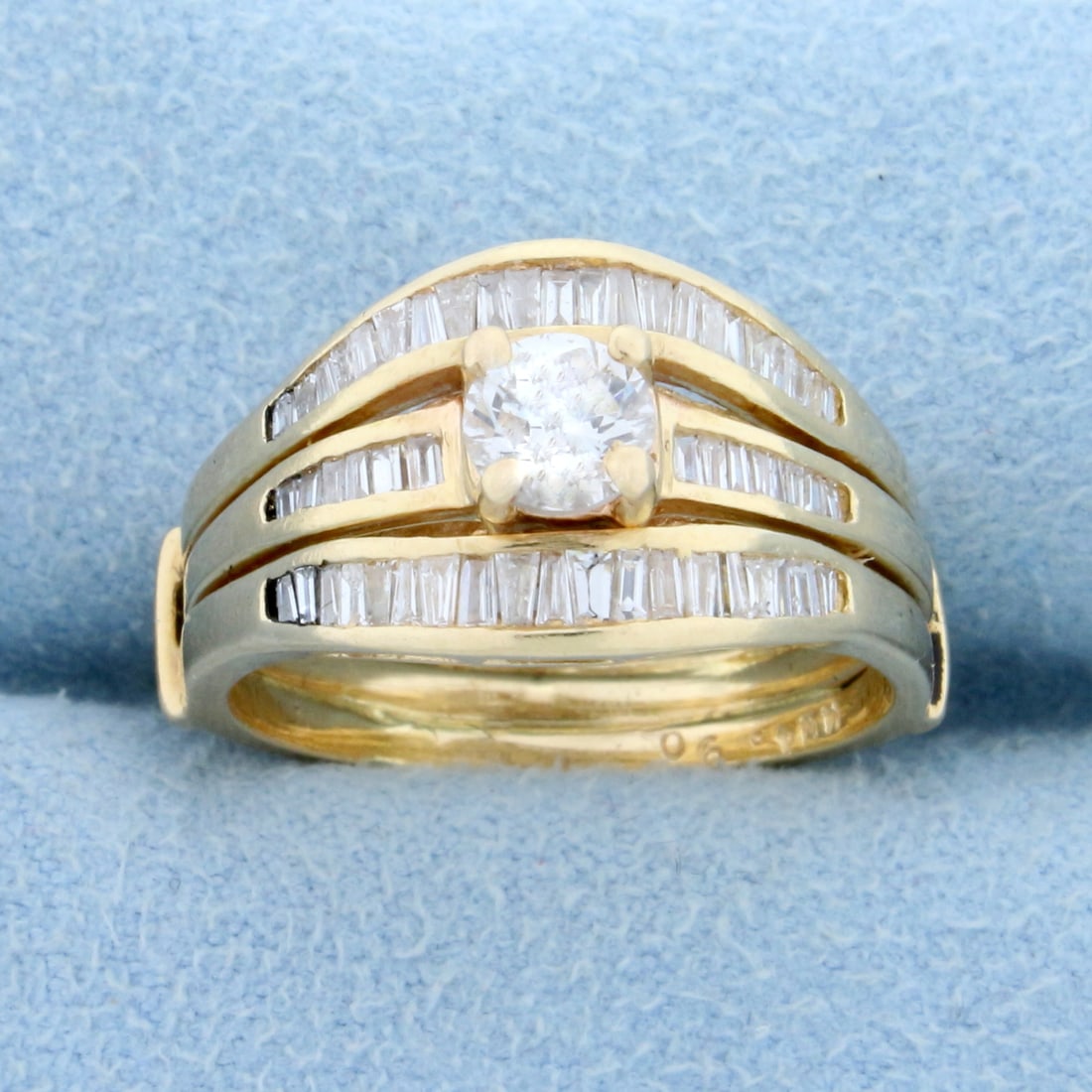 Vintage Baguette and Round Diamond Engagement Ring in 14K Yellow Gold: In 14K Yellow Gold. Contains a .4ct high quality round brilliant diamond, I color/I clarity, eye clean, great cut for added brilliance. Also contains fifty five high quality baguette Diamonds, 1/2ct T
