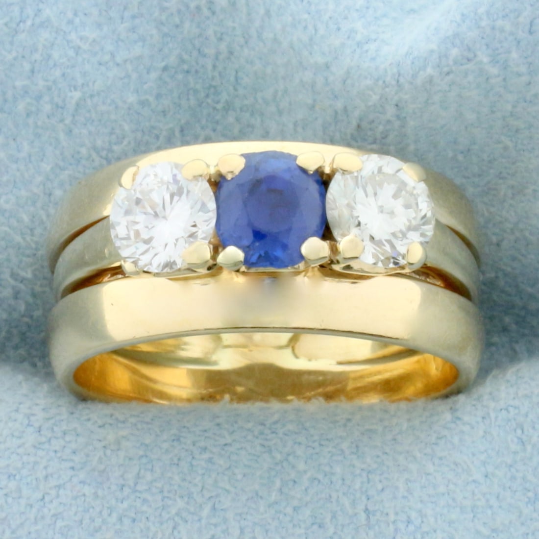 Vintage Three Stone Sapphire and Diamond Wedding or Anniversary Ring in 14k Yellow Gold: In 14K Yellow Gold. Contains one high quality natural AAA quality 1/2ct Sapphire gemstone with vibrant blue color and excellent clarity. Also contains two high quality 1/2ct round brilliant cut Diamon