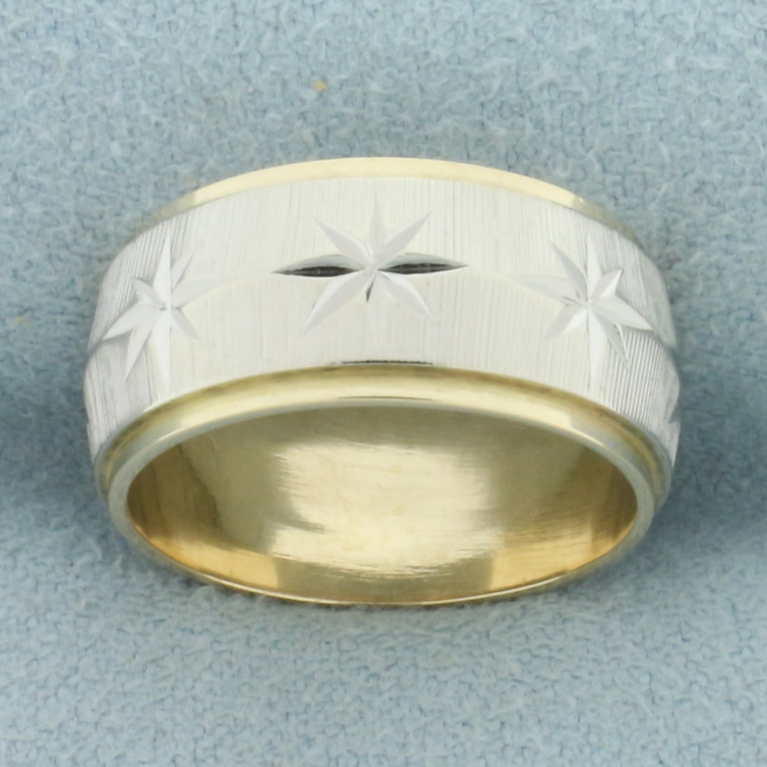 Two Tone Star Design Band Ring in 14k White and Yellow Gold: In 14k white and yellow gold. 8.1mm wide. Size: 5. 6.1g.