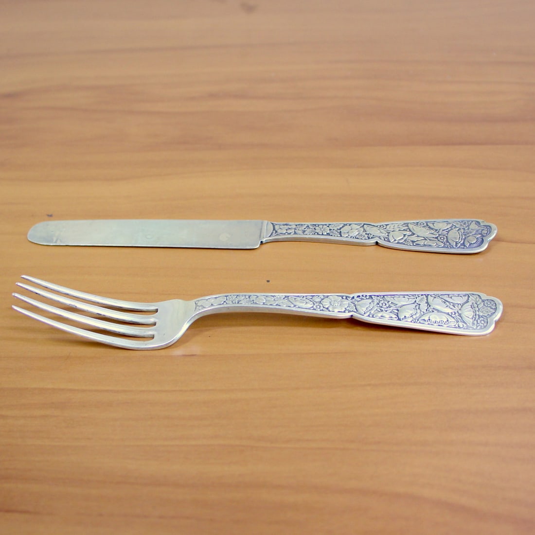 Antique Wood and Hughes Sterling Silver Fork and Knife Set: In .925 Sterling Silver. Contains one fork, 6 1/8 inches, and one flat solid knife, 6 3/4 inches long. 61.2g.
