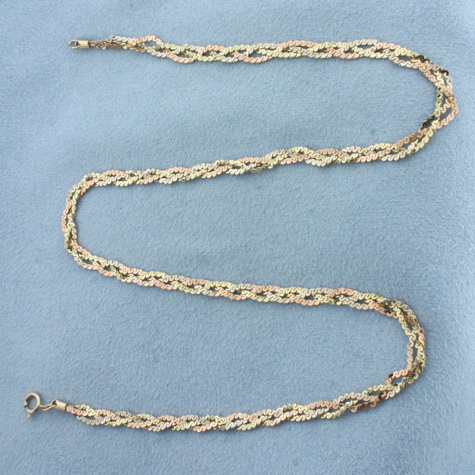 Tri-Color Braided S-Link Choker Necklace in 14k Yellow, White, and Rose Gold: In 14k Yellow, White, and Rose Gold. 16 inches long. 3.5mm wide. Spring clasp. 6.4g.