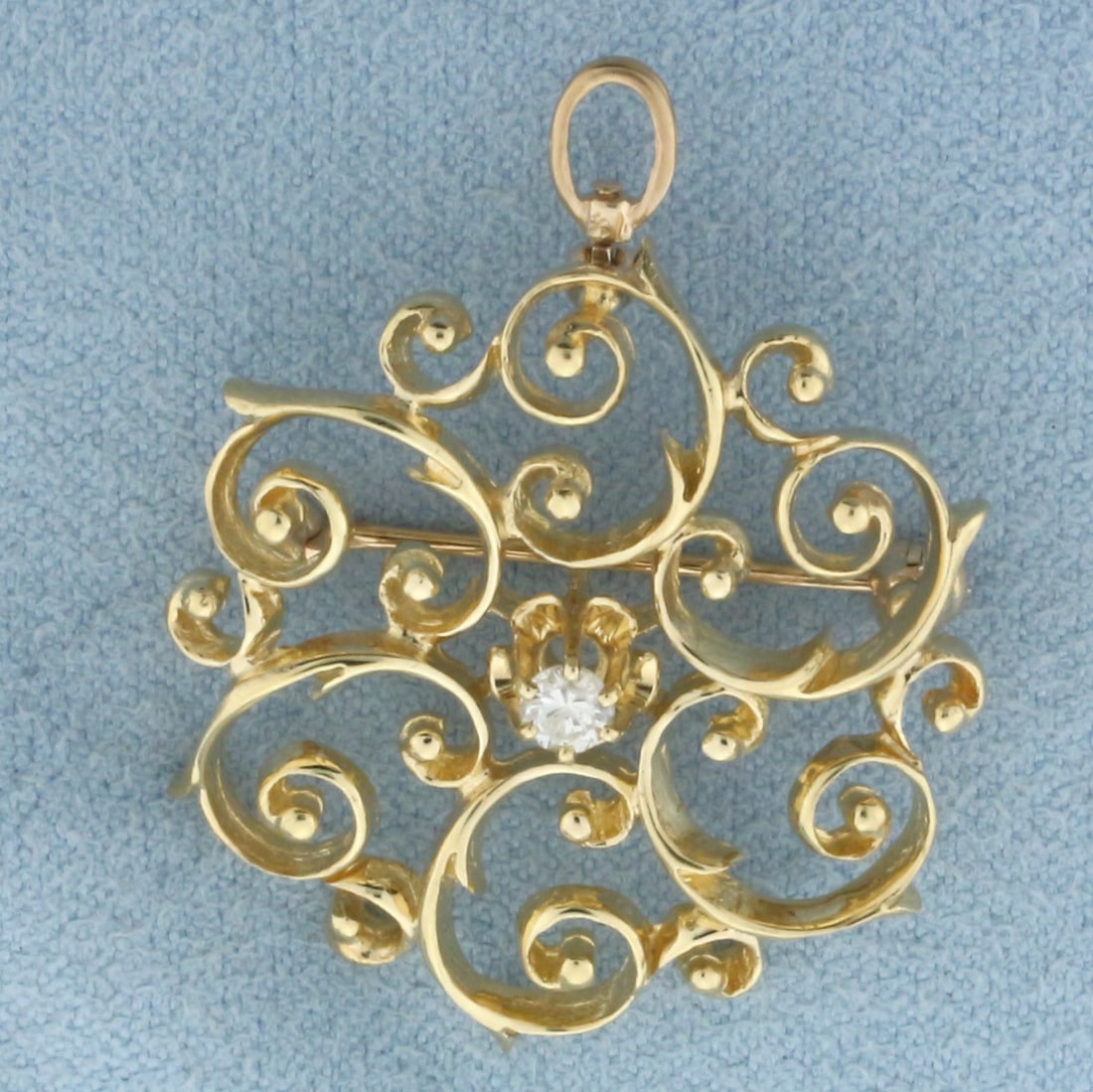 Vintage Buttercup Diamond Wirework Pendant or Pin Brooch in 14k Yellow Gold: In 14k Yellow Gold. Contains one high quality .10ct diamond, SI clarity/G color. 1 3/8 inch long. 1 inch wide. 5.4g.