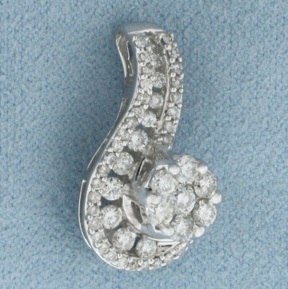 Diamond Swoop Pendant in 14k White Gold: In 14k White Gold. Contains fifty high quality diamonds, 1ct TW, SI2 clarity/G color. 3.7g.