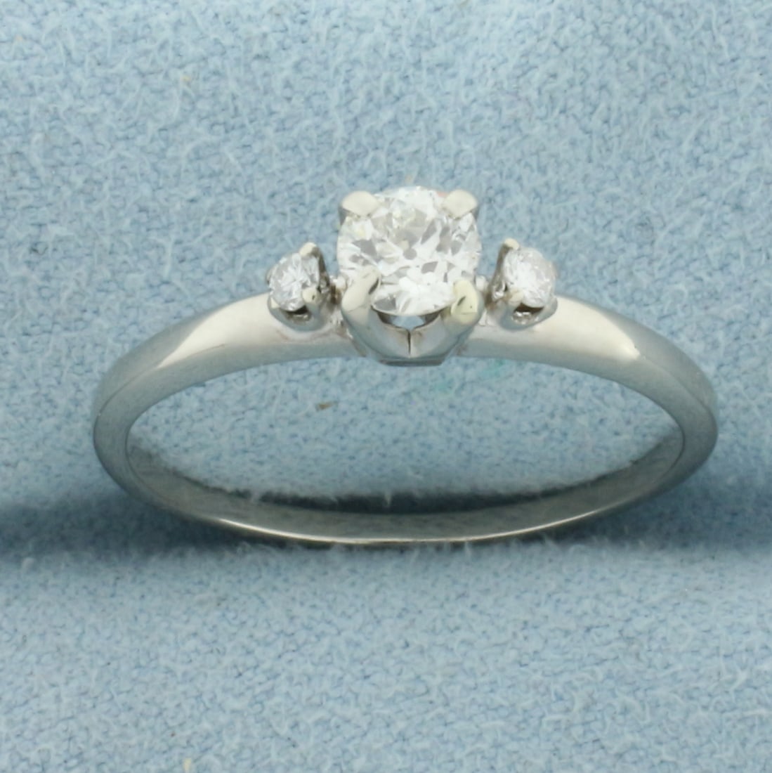 Antique Old European Three Stone Diamond Engagement Ring in 14k White Gold: In 14k White Gold. Contains one .4ct Old European cut diamond, VS clarity/G color. Also contains two .05ct diamonds of similar high quality. Size 9. 2.3g.