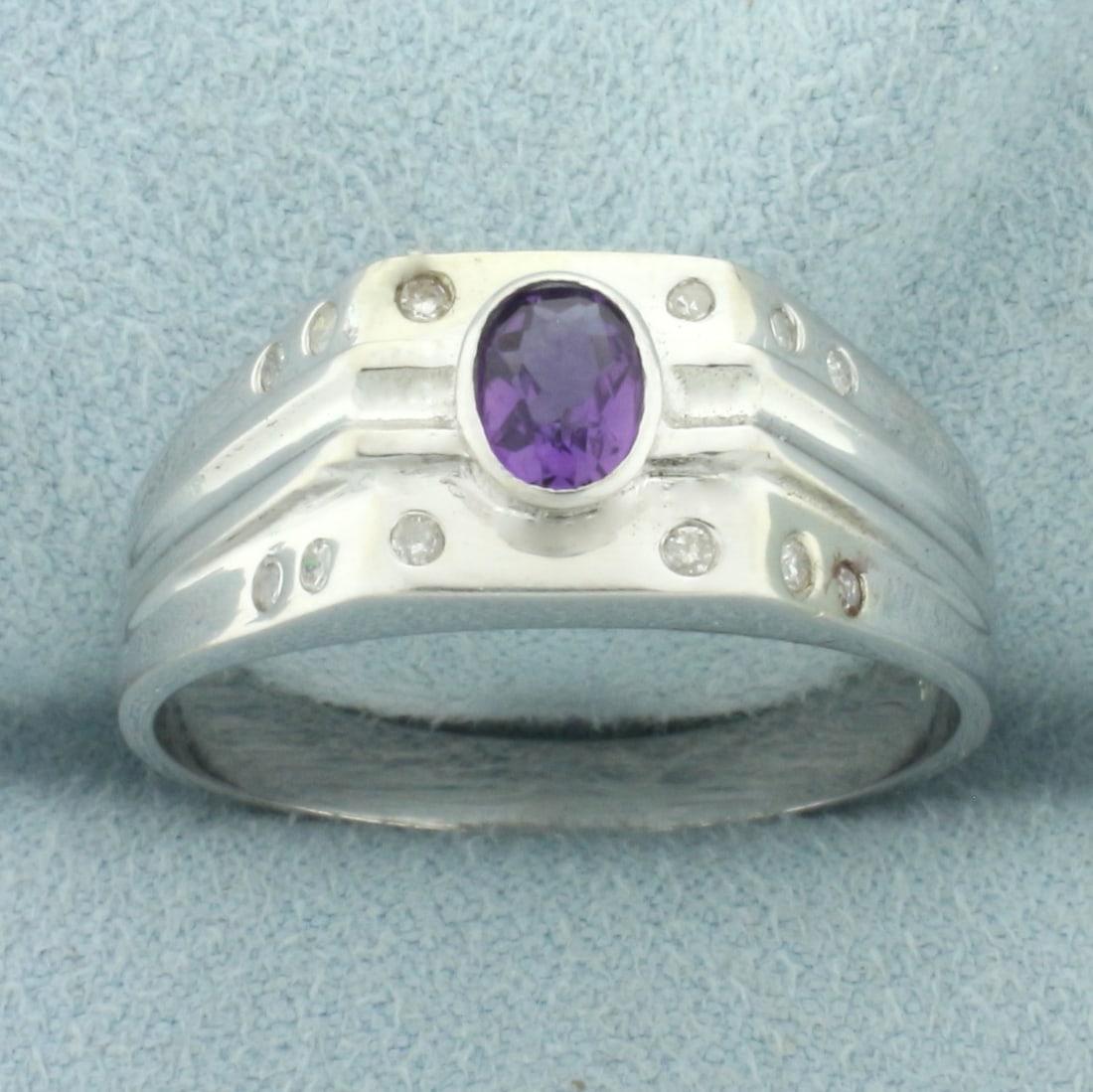 Amethyst and Diamond Ring in 10k White Gold: In 10k white gold. Contains one high quality natural 6mmx4mm oval cut amethyst gemstone, 1/2ct, with intense color and excellent clarity. Also contains twelve high quality .01ct diamonds, H color/I cl