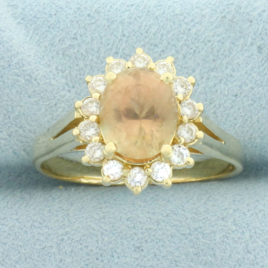 Golden Citrine and Diamond Halo Ring in 14k Yellow Gold: In 14k Yellow Gold. Contains one 9mm high quality Golden Citrine Gemstone with beautiful golden color and excellent clarity. Also contains fourteen high quality diamonds, 1/2ct TW, VS clarity/I color.