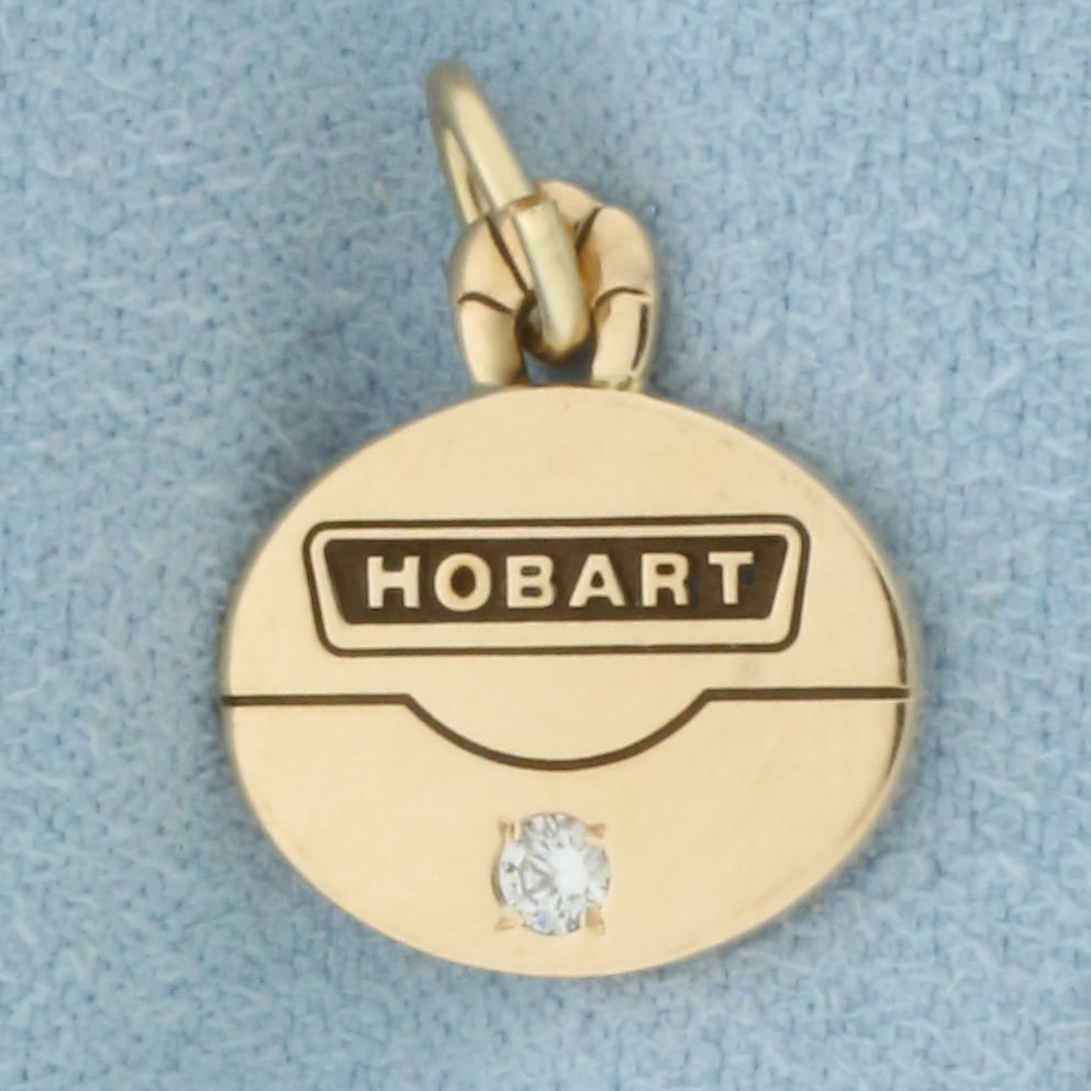 Vintage Hobart Corporate Diamond Charm in 10k Yellow Gold: In 10k Yellow Gold. Contains one .03ct high quality diamond, SI clarity/H color. 1/2 inch long. 1/2 inch wide. 1.7g.