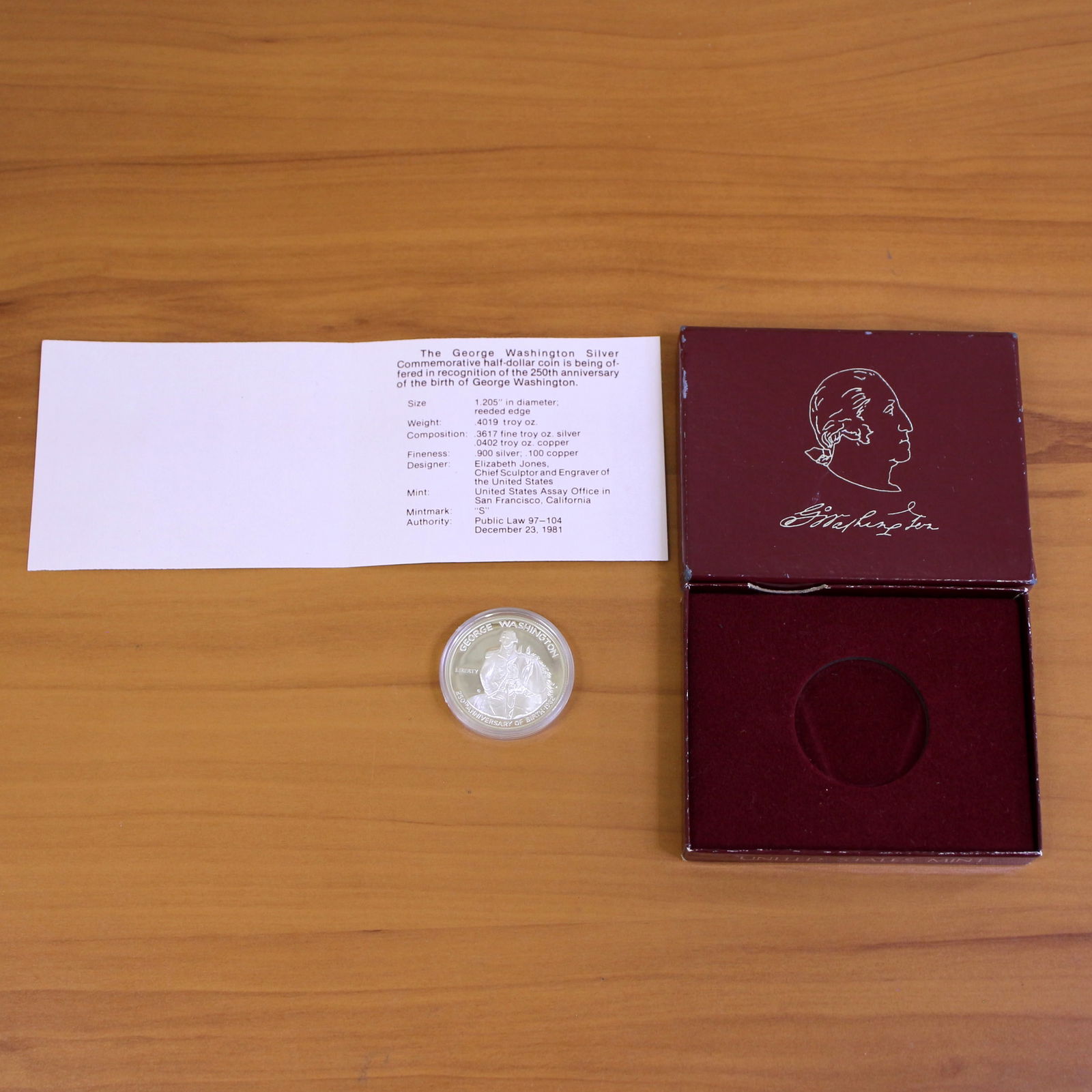US Mint George Washington 250th Anniversary Silver Dollar Coin OGP: Contains one 1732-1982 90% Silver Commemorative Silver Half Dollar. Set in original packaging and contains certificate of authenticity.