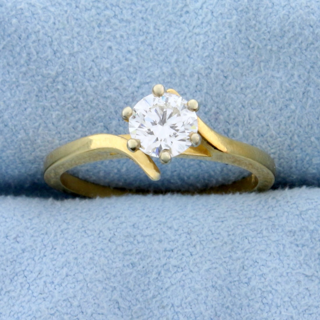 Bypass Diamond Solitaire Engagement Ring in 14k Yellow Gold: In 18k yellow gold, .57ct round brilliant diamond with very high quality VS clarity/H color. Size 6 1/4. 2.5g.